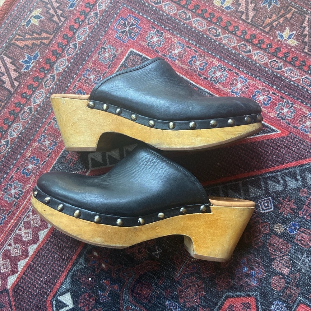 Black leather wooden clogs